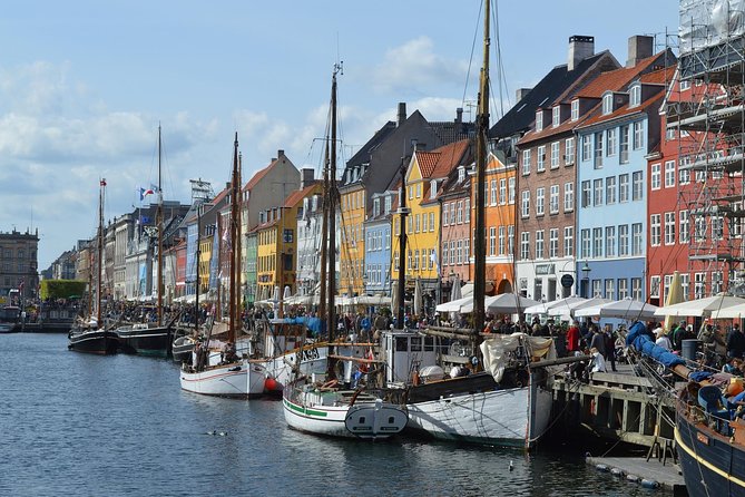 Painted merchant houses and wooden masts along the Nyhavn canal in Copenhagen